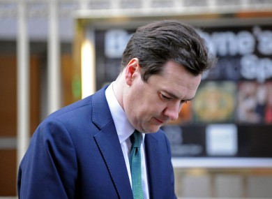 British chancellor George Osborne leaves the BBC's Millbank Studios this morning after revealing that the UK had offered Ireland a £7bn loan.