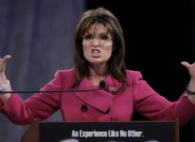 Sarah Palin's personal credit card details and website were hacked after she said Julian Assange had
