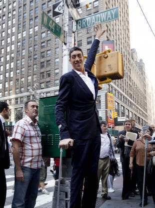 Sultan Kosen, the world's tallest man, can expect plenty of hugs today