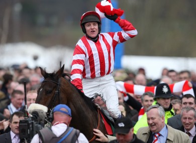 Victorious jockey Barry Geraghty celebrates on board Forpadydeplasterer after the 2009 Arkle Chase at Cheltenham