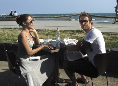 Brawn GP driver Jenson Button enjoys a quiet moment with his girlfriend Jessica Michibata at Melbourne's St Kilda beach earlier.