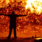 A youth watchs a bonfire on the Shankill Road in Belfast the night before the Twelfth of July loyalist celebration in 2007.