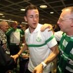 Billy Dennehy celebrates with a fan.
