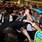 Gardaí help the players make their way through arrivals.