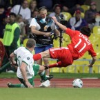 Richard Dunne tackles Yuri Zhirkov of Russia on his way to cutting his face.