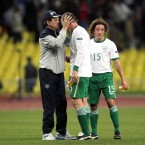 Fitness coach Fausto Rossi embraces Richard Dunne.