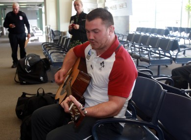 Damien Varley bangs out the tunes as the Irish team depart for Dunedin.