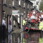 Dublin City Council workers clean blocked drains at Harry's Terrace in Kilmainham. Image: Leon Farrell/Photocall Ireland