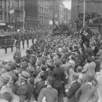 Crowds at Nelson's Pillar on O'Connell Street are all eager to catch a glimpse of the new President.