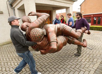 Declan Kidney watches as a temporary statue created to promote the Heineken Cup is moved into place (file photo).