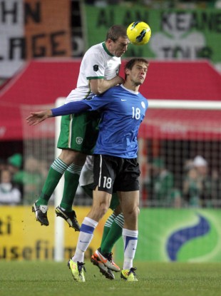 Ireland's Richard Dunne with Jarmo Ahjupera of Estonia.