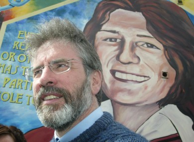 Adams pictured in front of a mural of Sands in 2005