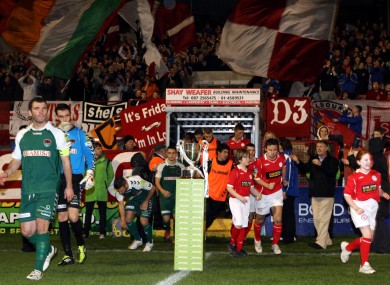 Shelbourne and Cork City come out past the First Division trophy during last season's title decider.