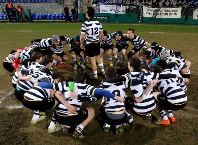 Roscrea captain Dan Lavelle leads the team huddle before their Leinster Schools Junior League Final Replay against CBS Monkstown.