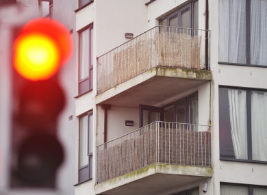 A traffic light in front of the apartments at Priory Hall