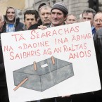 Tom Wallace from Connemara with his artist's impression of a septic tank at a protest in January 2012 on the proposed inspection fee - some argued it was an attack on rural householders. (Pic: Laura Hutton/Photocall Ireland)