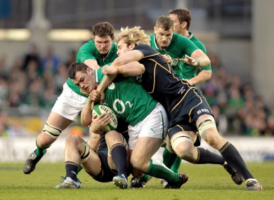 Richie Gray and David Denton look to take down Cian Healy.