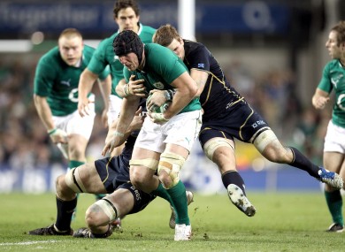 Ferris is tackled by John Barclay and Richie Gray at Lansdowne Road.