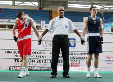A dejected Ross Hickey before the referee declares Dimitri Galagot of Moldova the winner.
