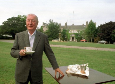 Charlie Haughey with a cup of tea outside his north Dublin mansion in 1995