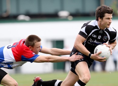 Sligo's Brendan Egan avoids Donnacha O'Dwyer of New York.