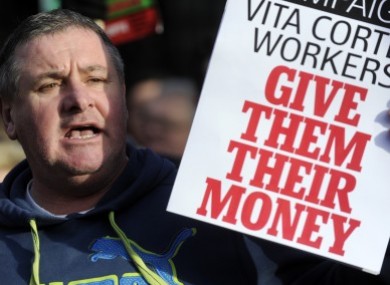 A protester shows support for the Vita Cortex workers at a public rally at Leinster House in January