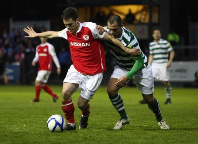 John Russell of St Pat's fends off Chris Turner of Shamrock Rovers during April's league meeting.
