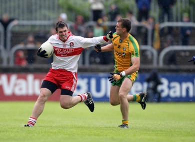 Donegal's Eamon McGee with Mark Lynch of Derry.