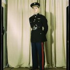Marine Corps Captain in dress blue uniform.