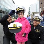 Seven-year-old Yasmine Dincbudak from Tallaght with sailors from Ecuador Israel Paredes and Franks Santos. (Sasko Lazarov/Photocall Ireland)
