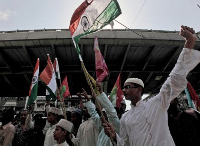 Indian Muslim youths celebrate after the judgement of the death sentence in May 2010