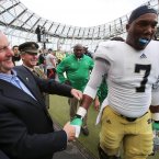 An Taoiseach Enda Kenny greets Notre Dame player Stephon Tuitt with a friendly box. ©INPHO/Cathal Noonan