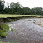 The River Clywedog near Wrexham, North Wales where two bodies were recovered. The couple who were found in the swollen river may have drowned trying to rescue a pet dog, police said today. Image: Peter Byrne/PA Wire