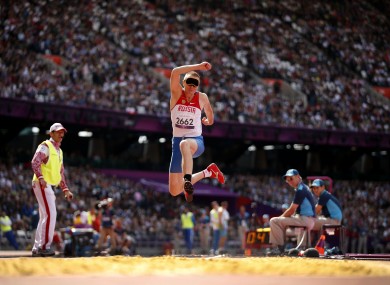 Russia's Denis Gulin jumps in the men's F11 triple jump.