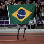 Brazil's Alan Fonteles Cardoso Oliveira celebrates after beating Oscar Pistorius in the Men's 200m T44 final. (AP Photo/Emilio Morenatti)