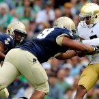 TJ Jones tackled by defensive end Wes Henderson. ©INPHO/James Crombie