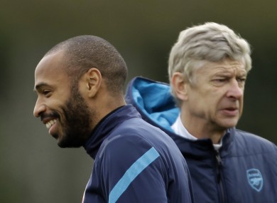 Henry (left) and Wenger during his time with the Gunners