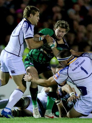 Kieran Marmion of Connacht is tackled by Leinster's Ian Madigan.