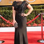 Kelly Osbourne, still with the purple hair. Looking well though. 