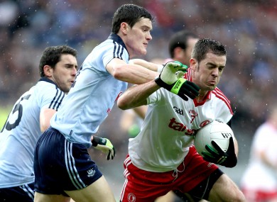 Dublin's Bernard Brogan and Diarmuid Connolly with Philip Jordan of Tyrone.