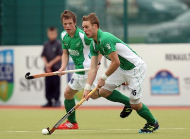Ames (on the ball) and Sloan in action for Ireland.