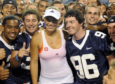 Rory McIlroy in a Swoosh-emblazoned jersey with girlfriend, Caroline Wozniacki.