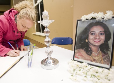 A woman signs a book of condolence for Savita Halappanavar in Galway in November.