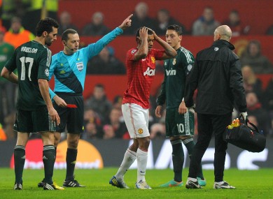 Manchester United's Nani is sent off after receiving a red card from referee Cuneyt Cakir.