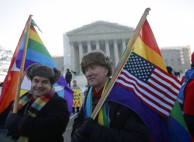 Marcus and Daniel German-Dominguez demonstrate outside the Supreme Court yesterday.