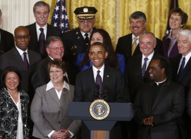 President Barack Obama smiles as he reacts to a buzzing sound from the back of the room as he speaks about immigration reform, Tuesday, June 11, 2013, in the East Room of the White House in Washington.