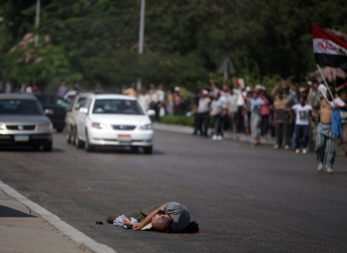A man lies dead after being shot by Egyptian troops in Cairo, Egypt.