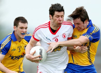 Roscommon's Niall Carty and David Keenan with Sean Cavanagh of Tyrone.