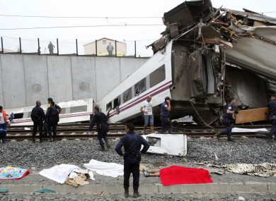 Emergency crew respond to the scene of a train derailment in Santiago de Compostela.