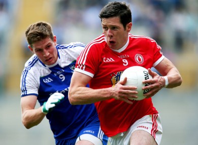 Monaghan's Darren Hughes and Sean Cavanagh of Tyrone.
